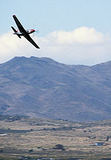 A plane flying over land property