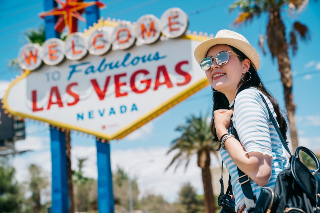 Woman in front of the famous Las Vegas sign