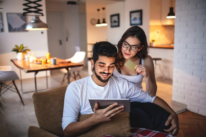 a young couple planning and budgeting to buy new home