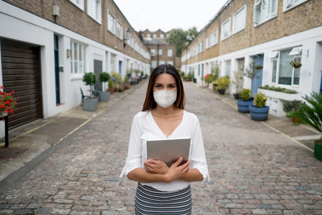 Portrait of a real estate agent wearing a facemask while showing houses during the COVID-19 pandemic - Loralee Wood | Las Vegas Realtor