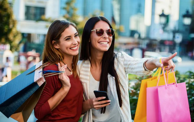 Happy women after shopping
