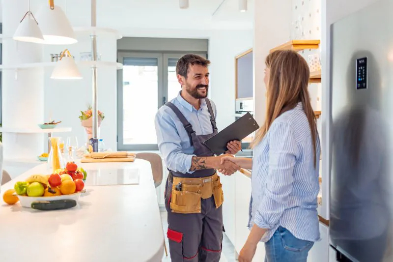 home inspector and the owner having shake hands