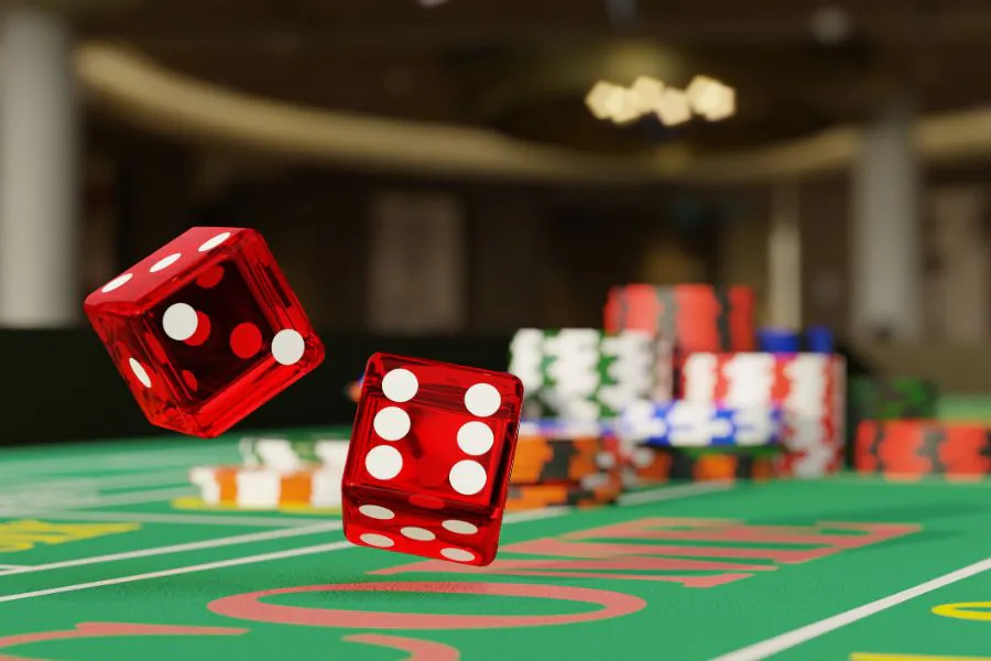 close up shot of a pair of dice rolling down a craps table selective